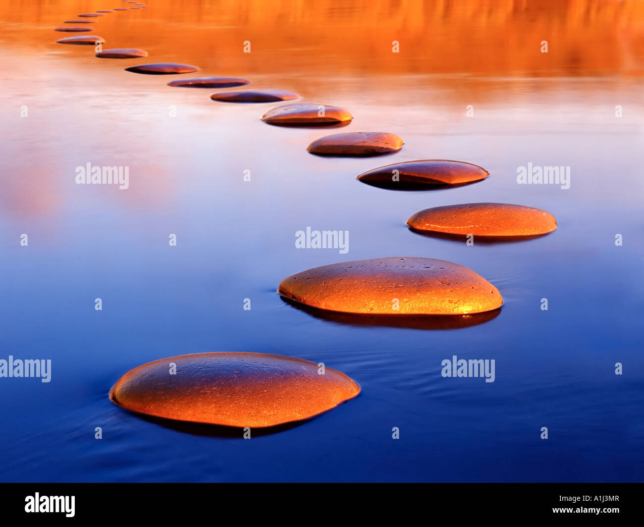 Stepping stones provide a safe passage through deep water Stock Photo
