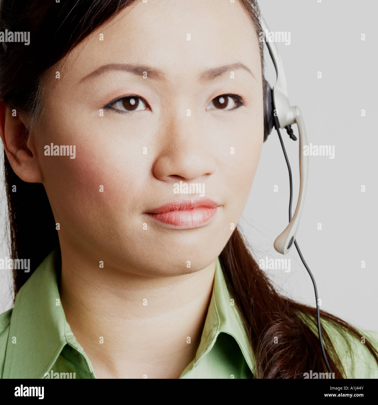 Thinking Customer Rep Close-up of a female customer service representative looking away and ...