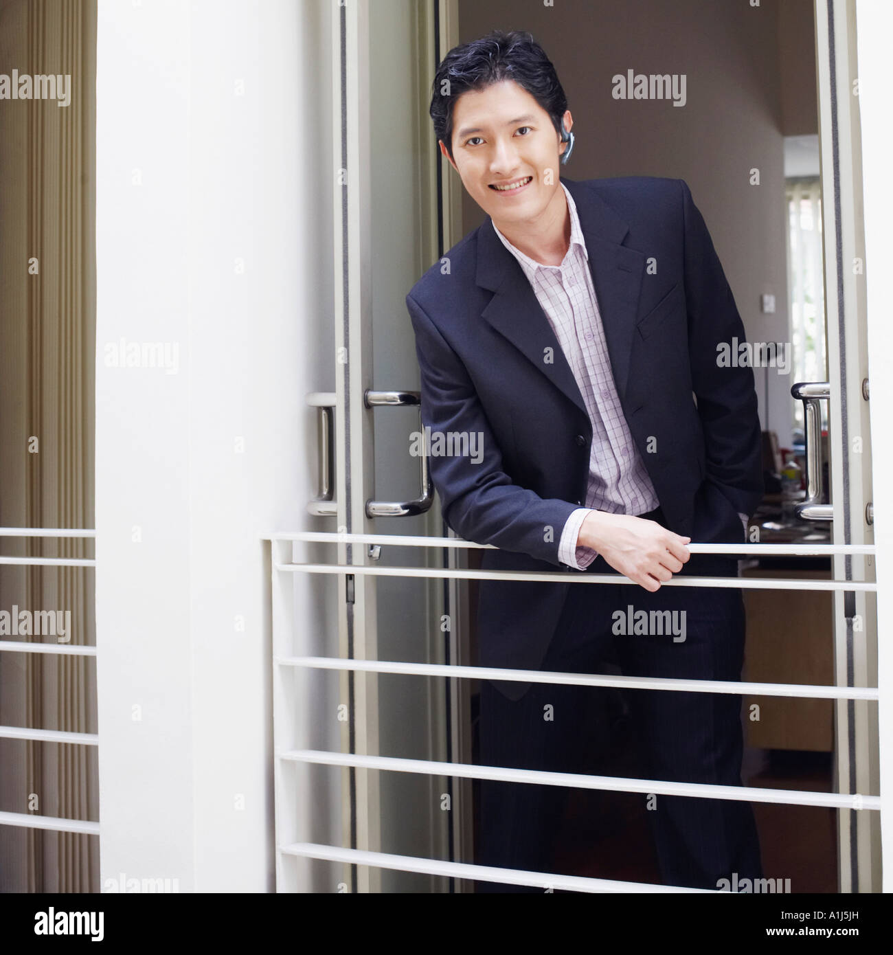 Portrait of a businessman smiling Stock Photo - Alamy