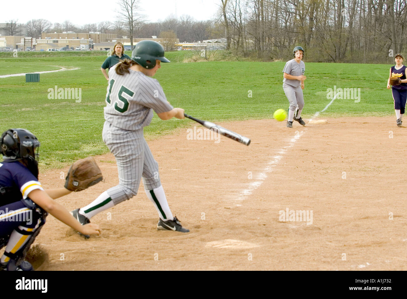 Baseball Softball action Female 12 to 14 year old girls Stock Photo