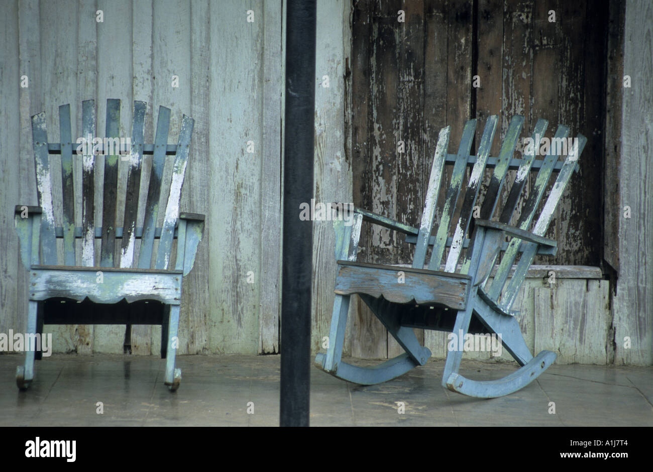 Cuba. Still life of two blue wooden rockingchairs on a verandah Stock