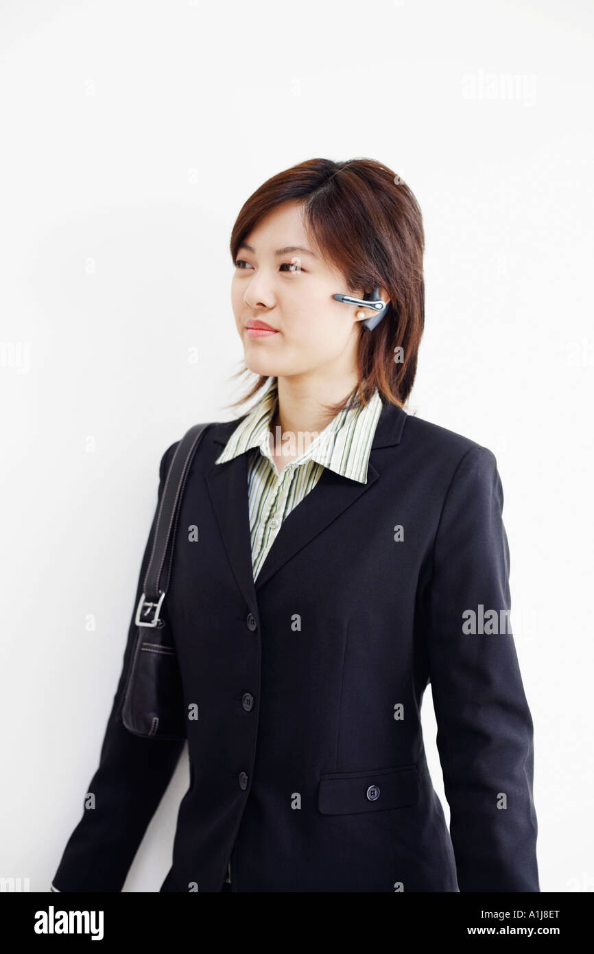 Close-up of a businesswoman using a hands free device Stock Photo