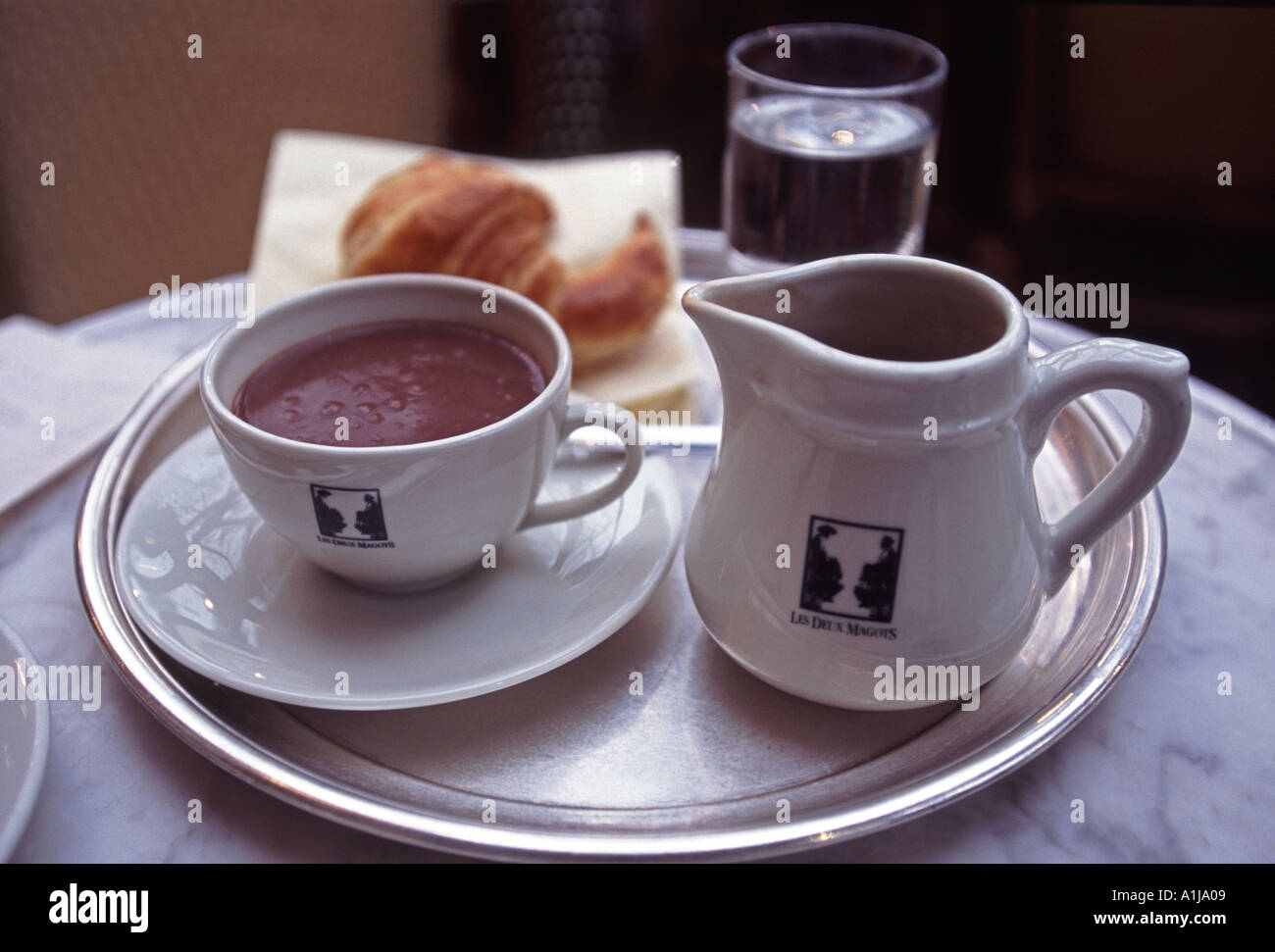 Hot Chocolate and Croissant Cafe Les Deux Magots St Germain Paris France Stock Photo