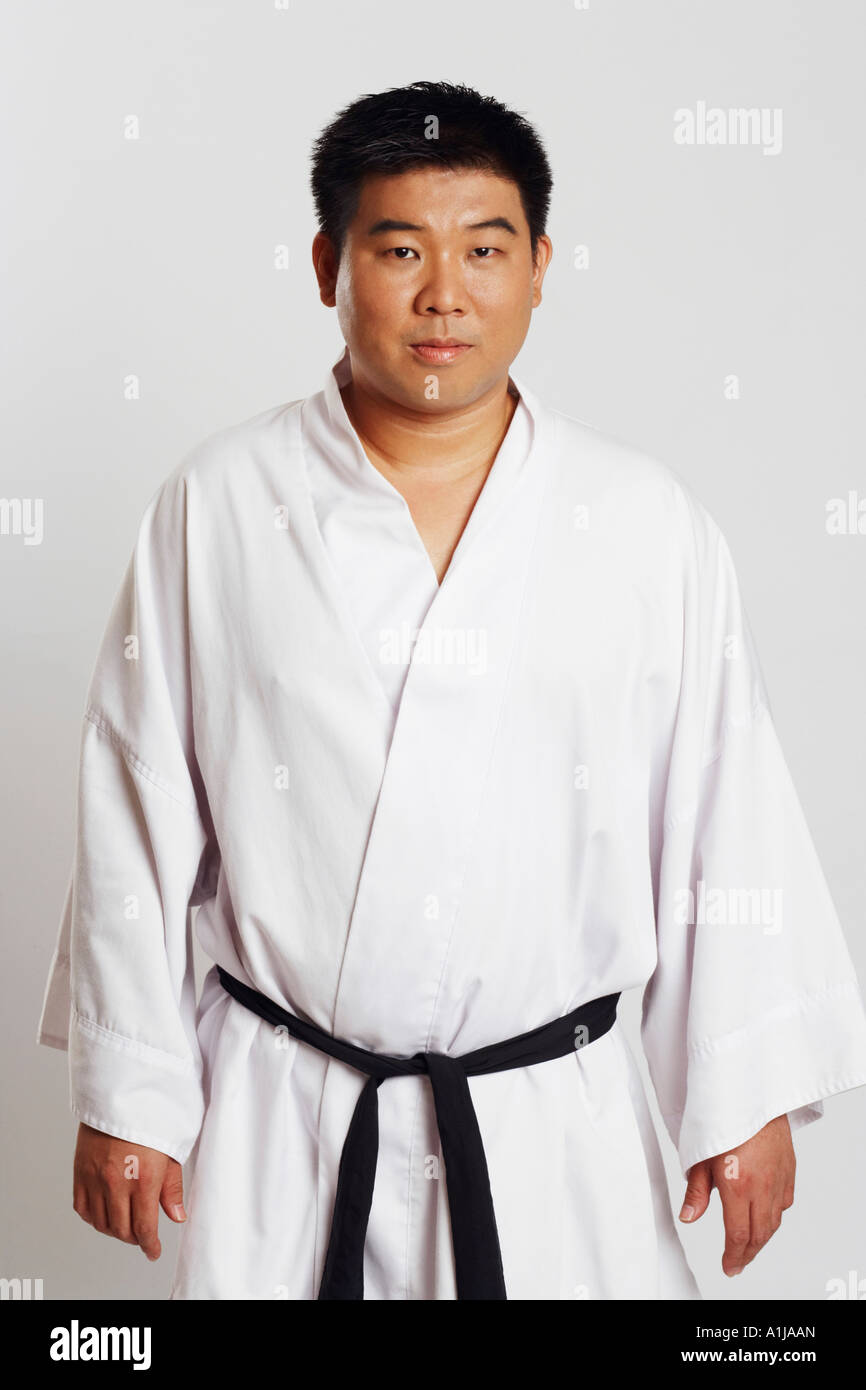 Portrait of a mid adult man wearing a karate uniform Stock Photo Alamy