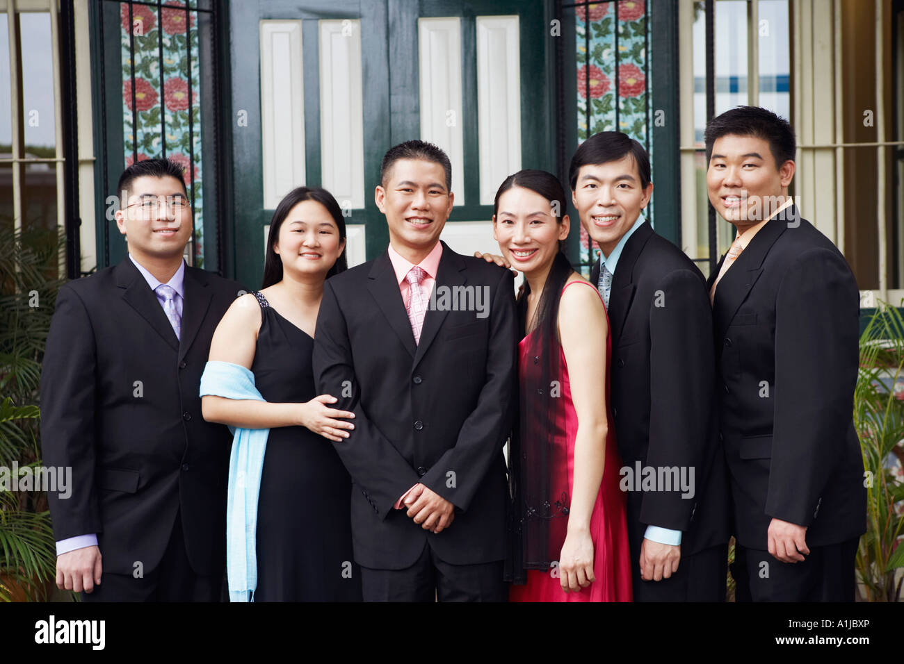 Portrait of businessmen and businesswomen smiling and standing Stock Photo