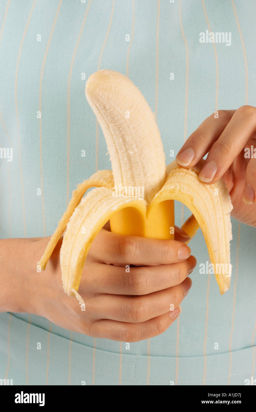 Woman holding banana peel hi-res stock photography and images - Alamy