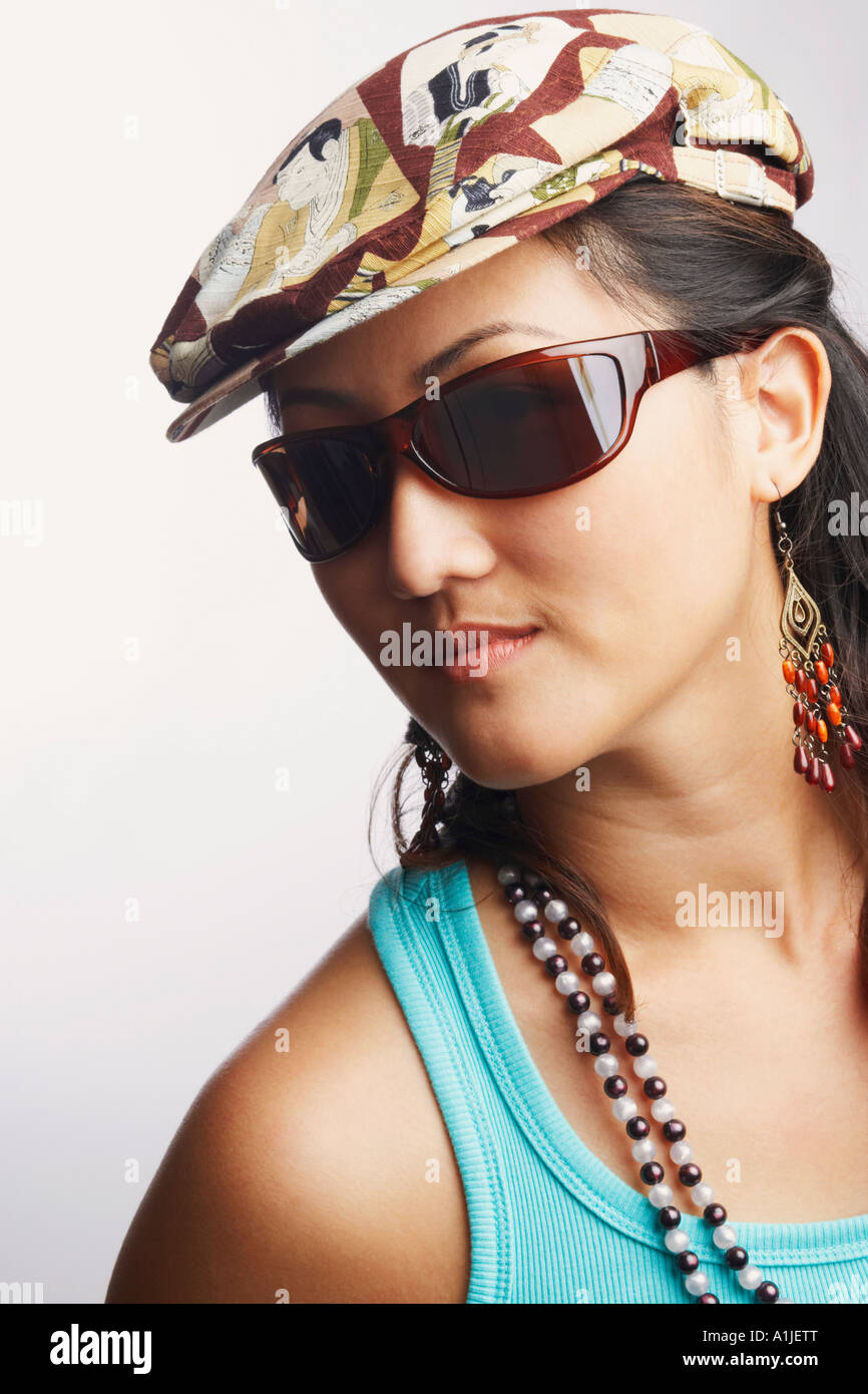 Portrait of a young woman wearing sunglasses Stock Photo - Alamy