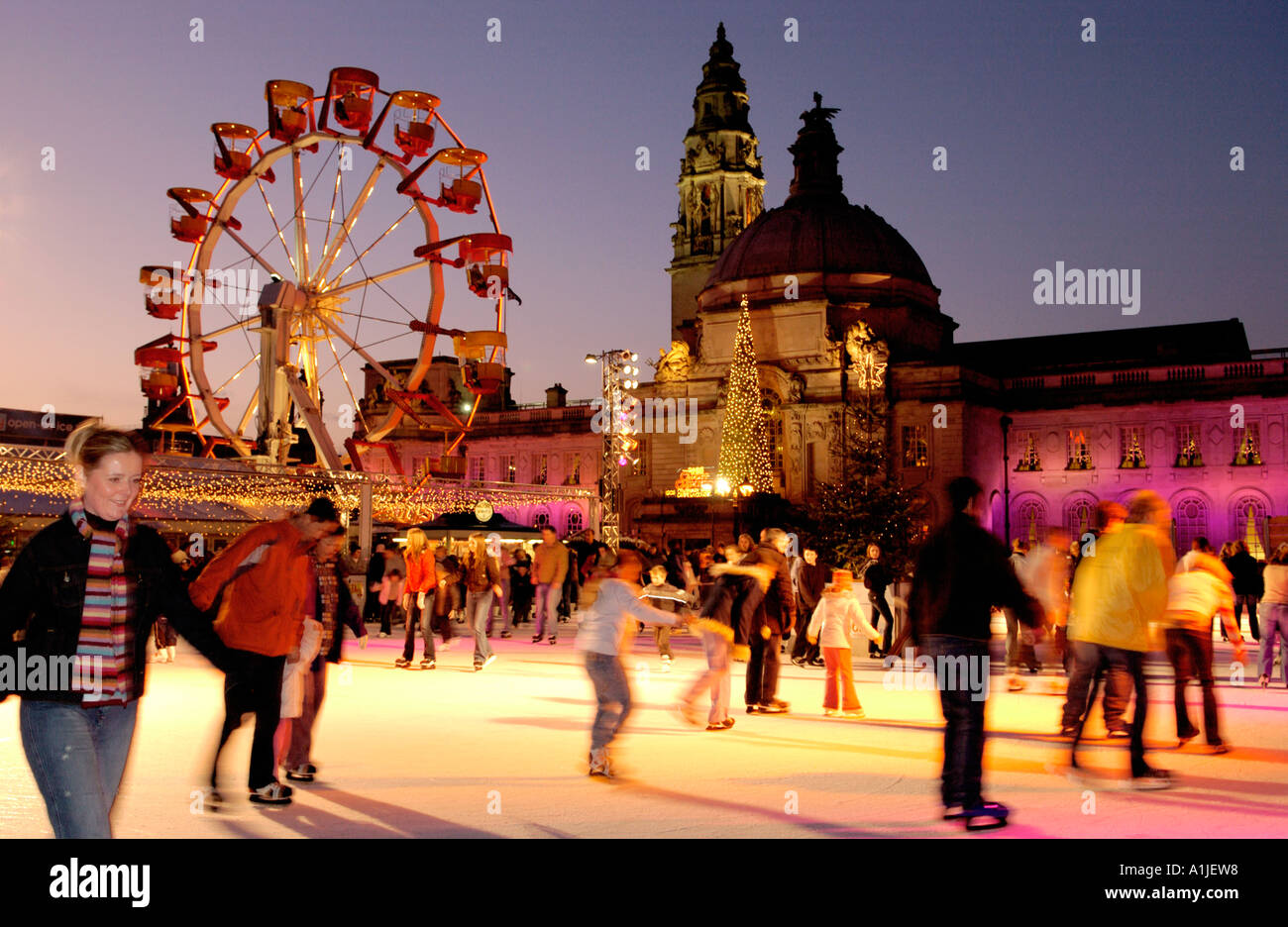 Winter Wonderland event outside Cardiff City Hall Wales UK with people skating on the ice rink