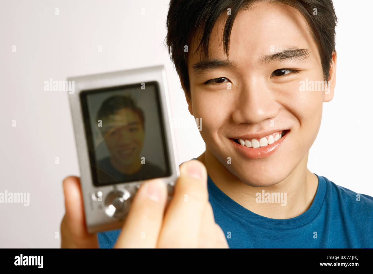 Close-up of a young man taking a picture of himself Stock Photo