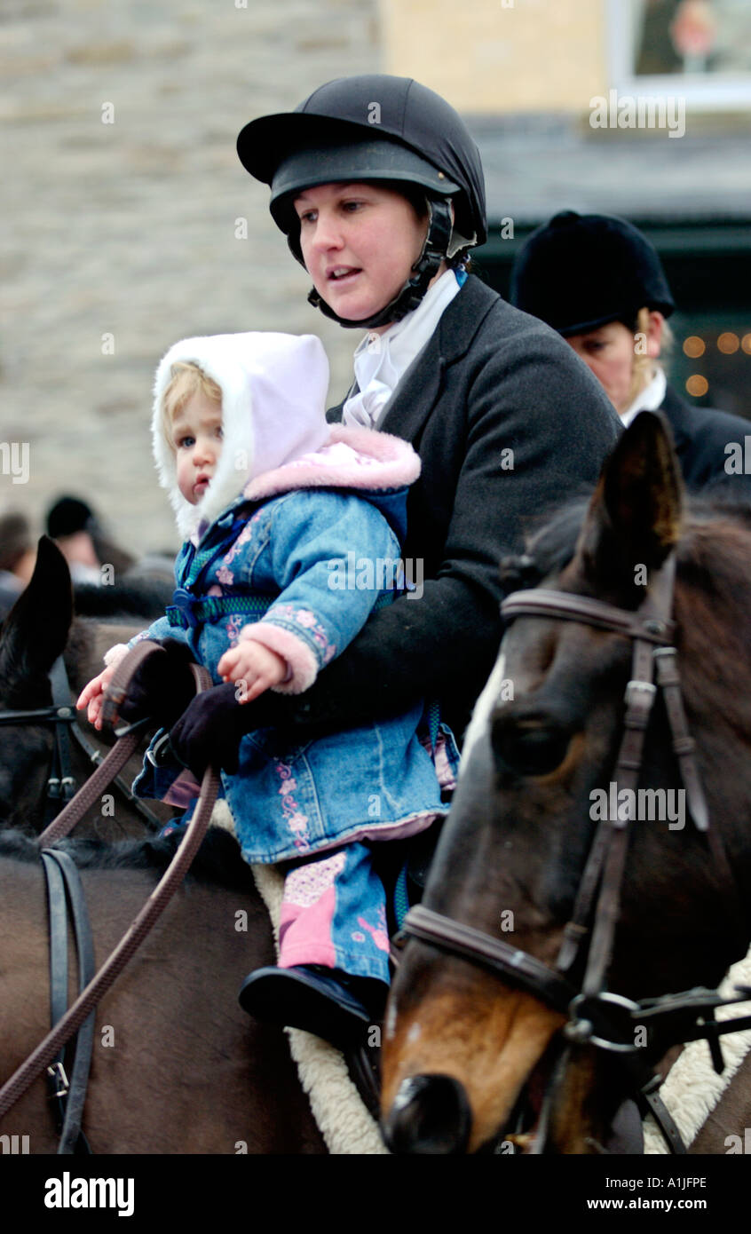 Golden Valley Hunt assemble at the Town Clock Square in Hay on Wye Powys Wales UK GB huntswoman with baby on horse Stock Photo