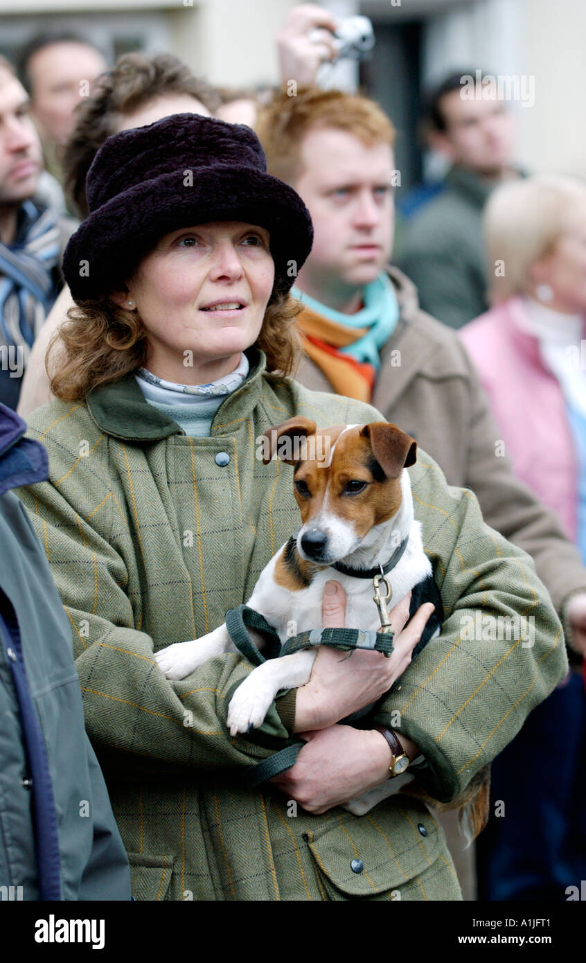 Golden Valley Hunt assemble at the Town Clock Square in Hay on Wye Powys Wales UK GB supporter carrying a Jack Russell Terrier Stock Photo