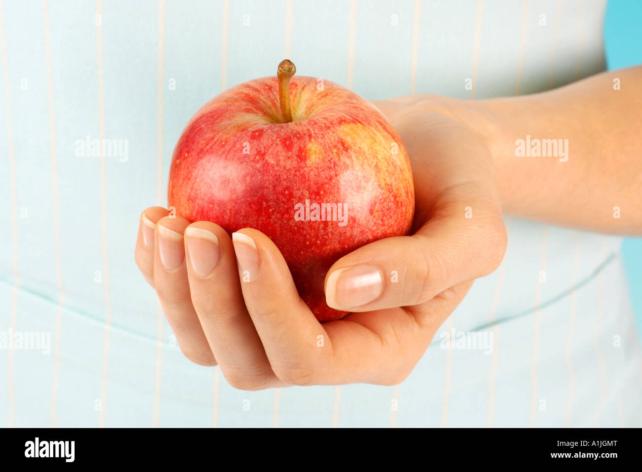 Hand red apple fruit hi-res stock photography and images - Alamy