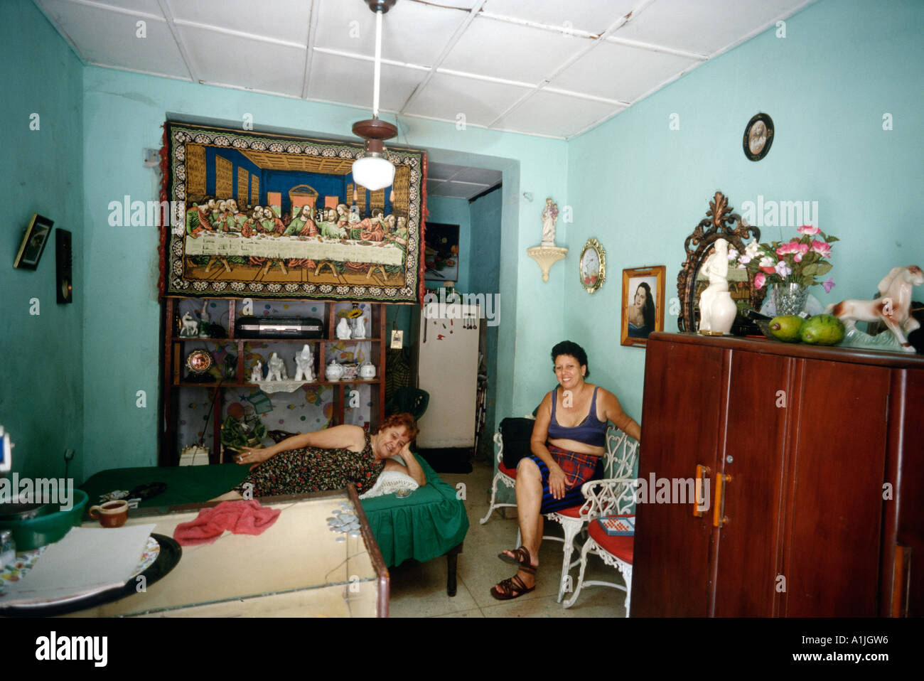 Havana Cuba Mother daughter in their appartment facing onto the street Centro Havana Stock Photo