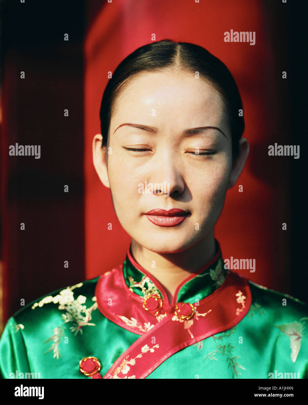 Close-up of a young woman meditating with her eyes closed Stock Photo