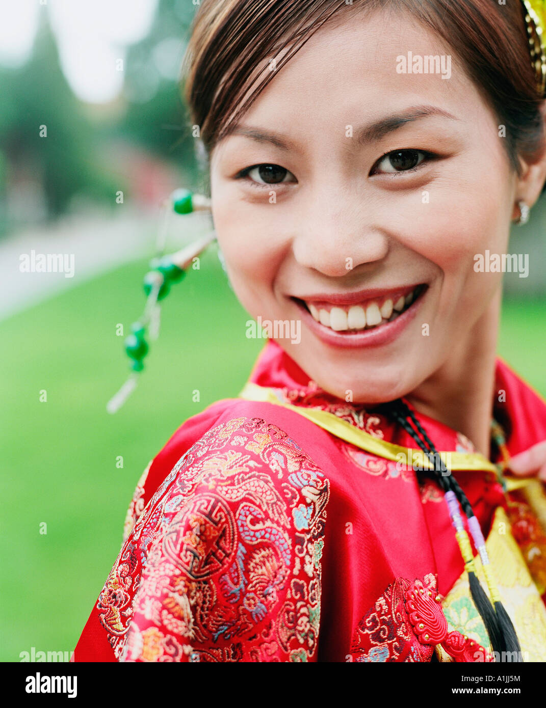 Portrait of a young woman in the traditional clothing smiling Stock ...