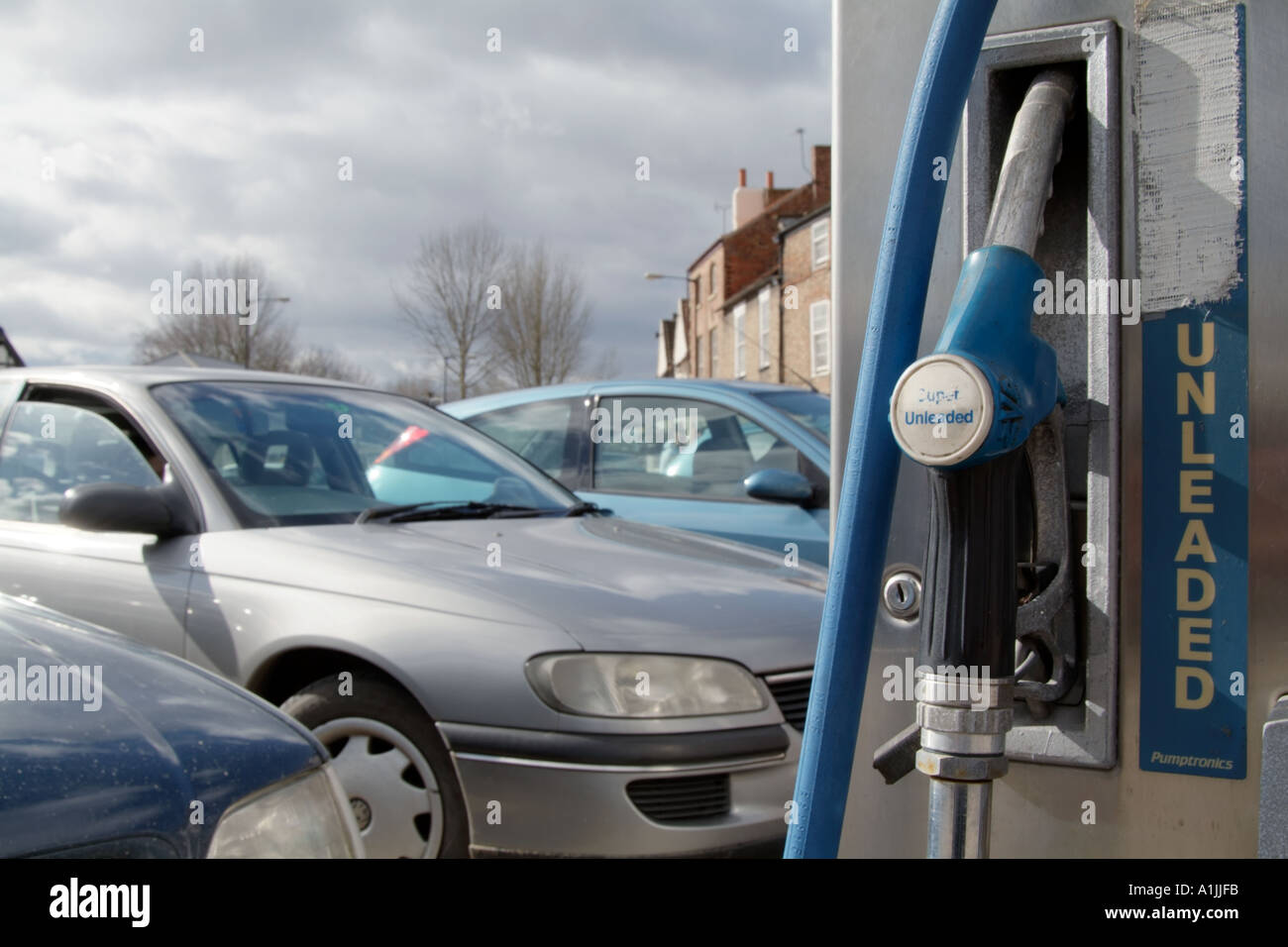 petrol pump gas station car oil diesel nozzle fill up burn fossil fuel