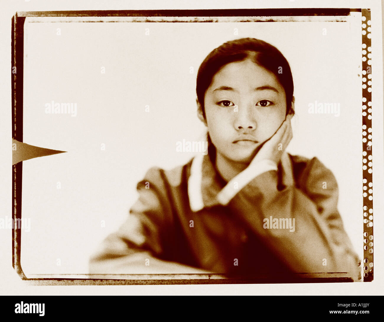 Portrait of a teenage girl looking pensive Stock Photo - Alamy