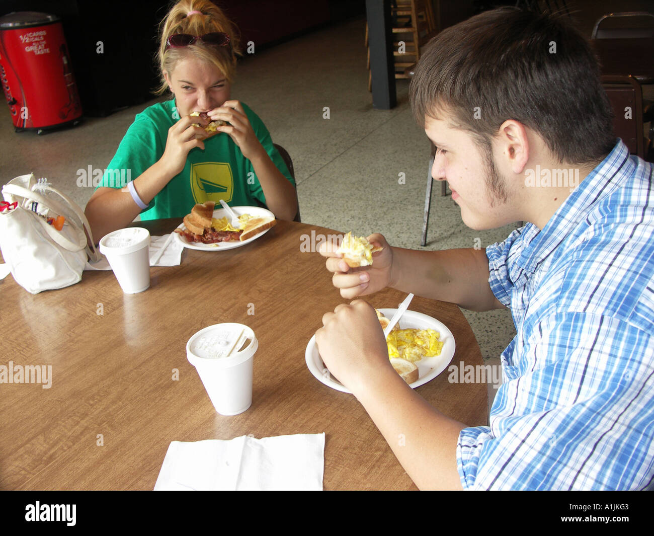 Teens eating Breakfast in Restaurant Stock Photo