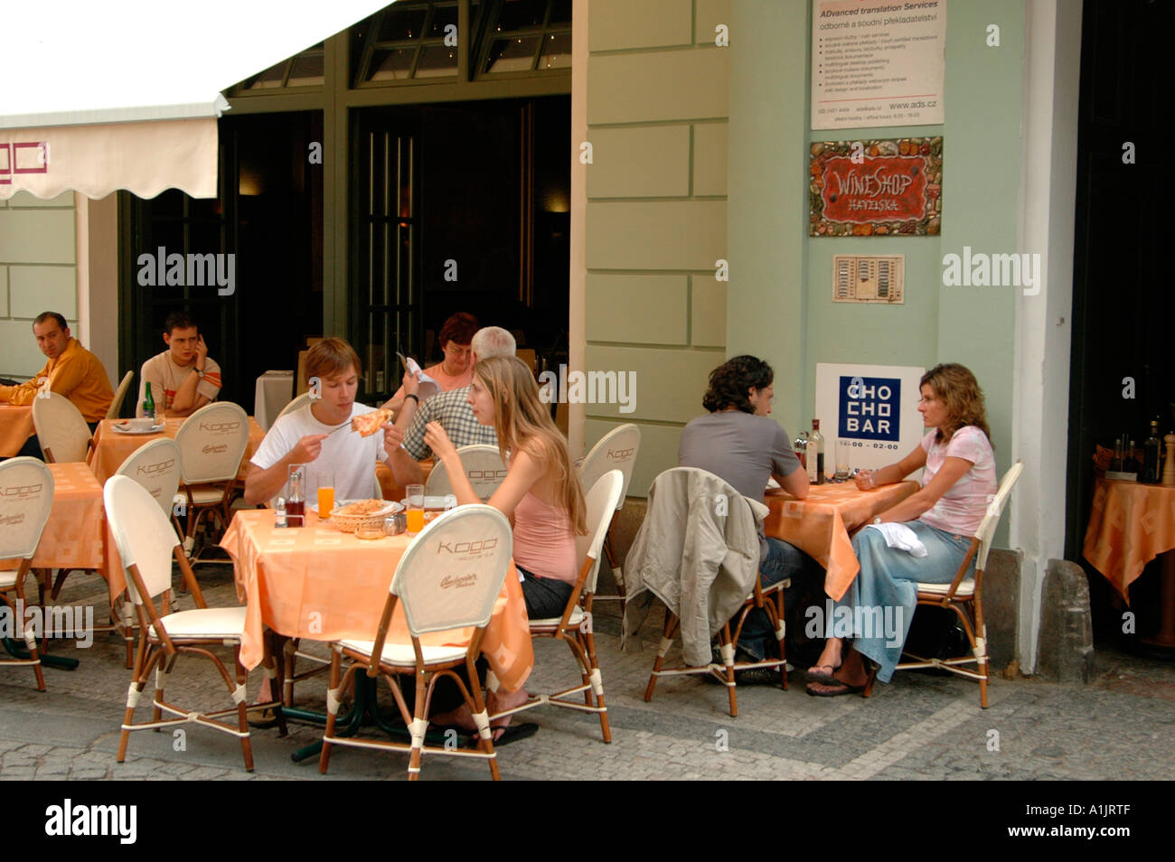 Customers dine outside at a restaurant in the old Town Stare Mesto Prague Czech Stock Photo