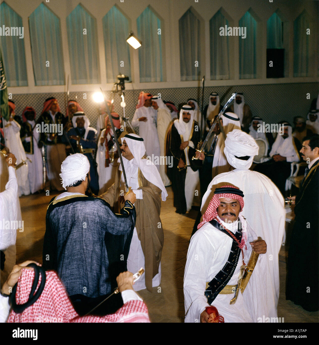 Saudi Arabia Men In Dish Dash Dancing With Swords Stock Photo