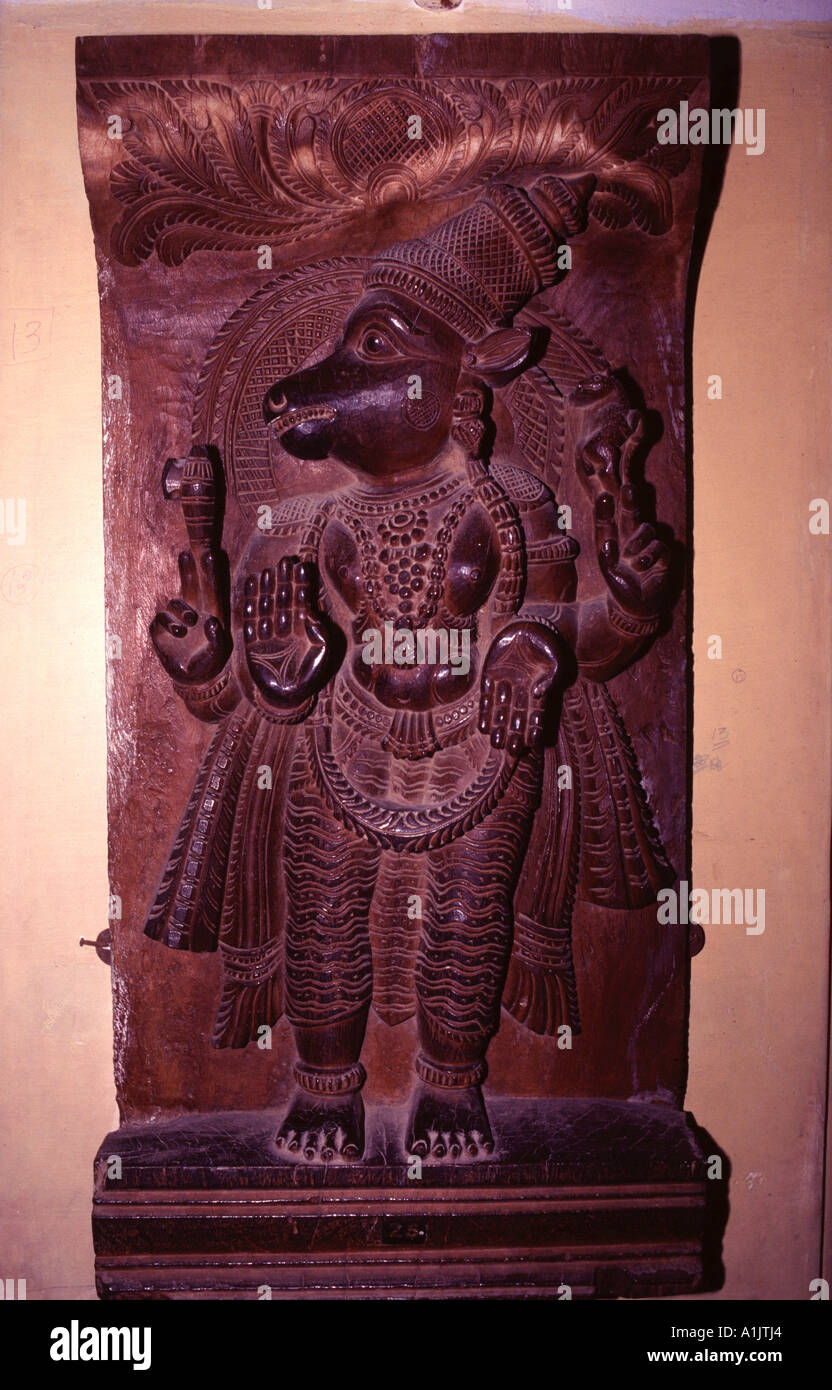 Ancient Hanuman deity carved on sandalwood India Stock Photo