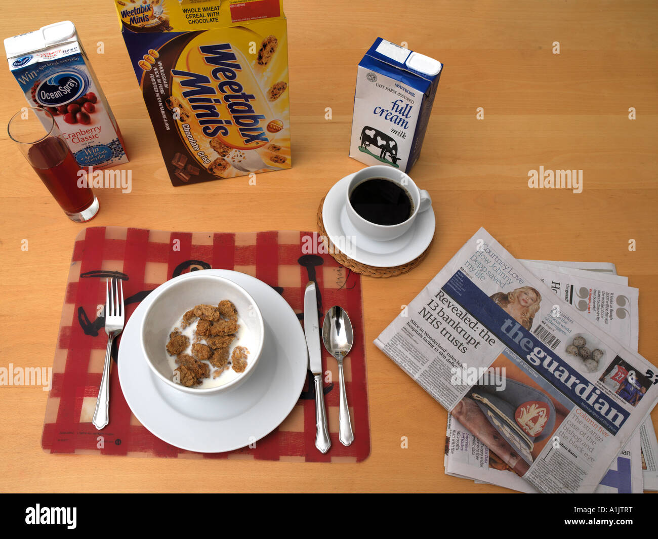 Breakfast Table with packages and Newspaper Stock Photo Alamy