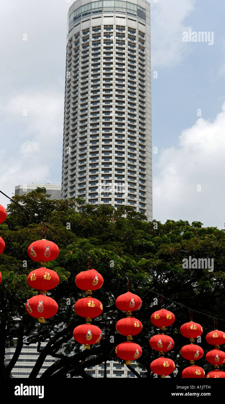 Colourful Chinese New Year Lanterns dwarfed by the Swissotel Stamford Stock Photo