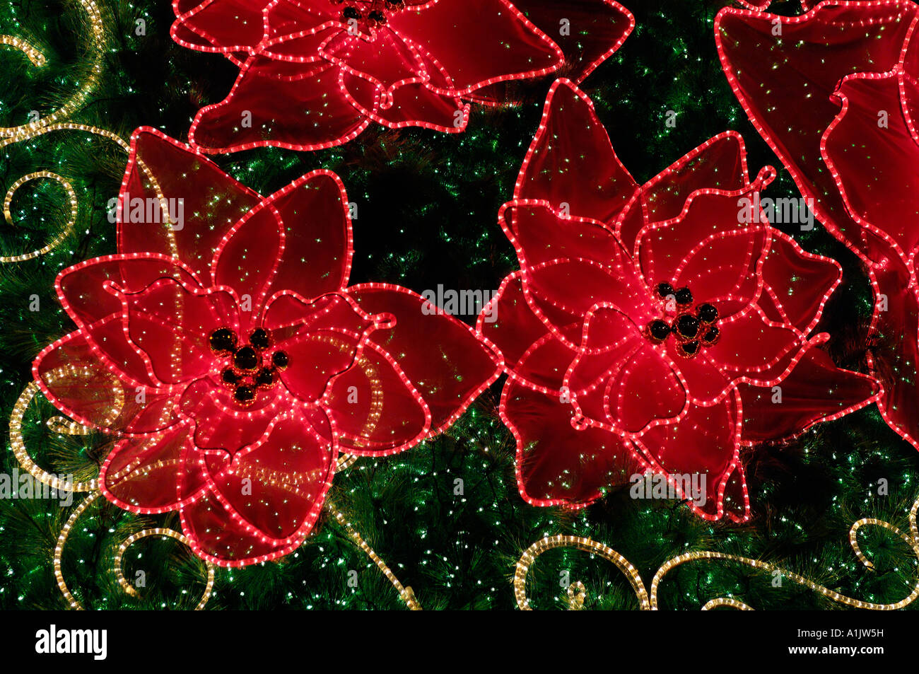 Christmas tree and orchid garland in Singapore outside the Raffles City shopping centre. Stock Photo