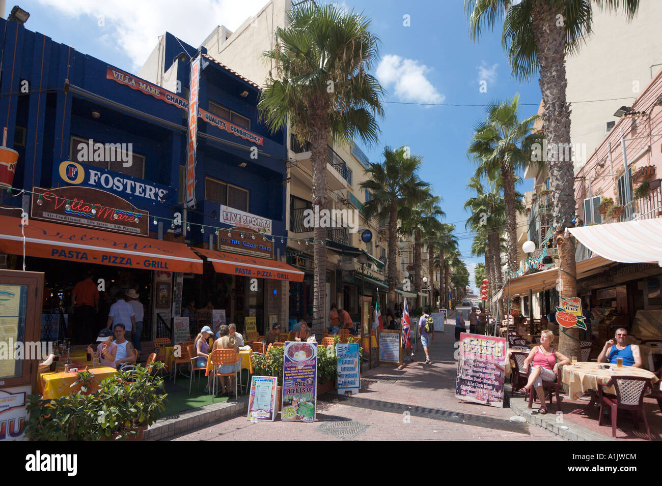 Bars and shops in the resort centre, Bugibba, Malta Stock Photo ...