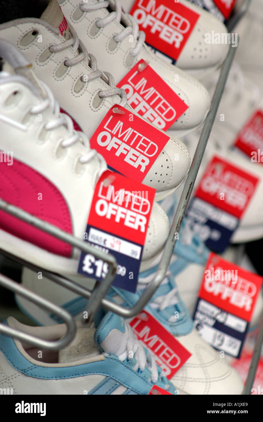 Shoe Shop Trainers on Special Offer Rack Stock Photo