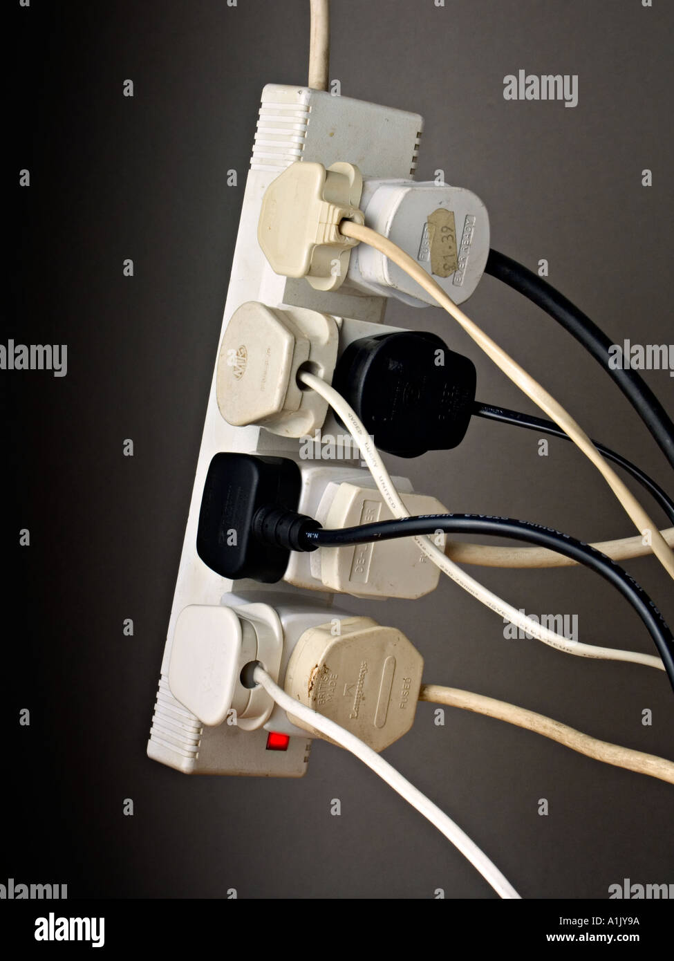 A dangerously overloaded extension cable Stock Photo - Alamy