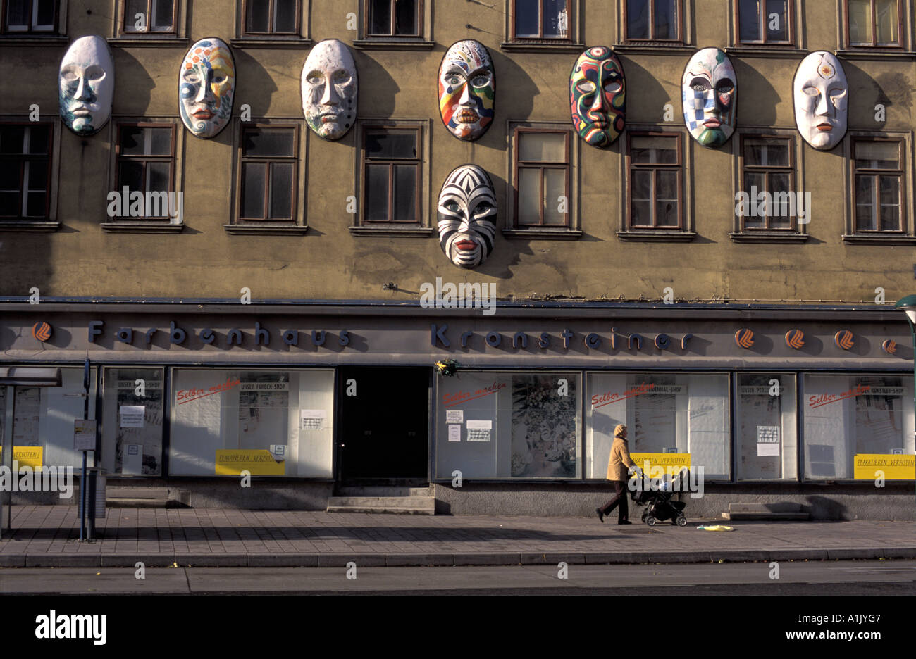 Face masks hanging on a house Vienna Austria Stock Photo