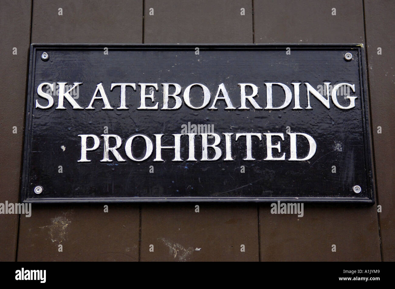 skateboarding prohibited sign rules regulations urban city black white