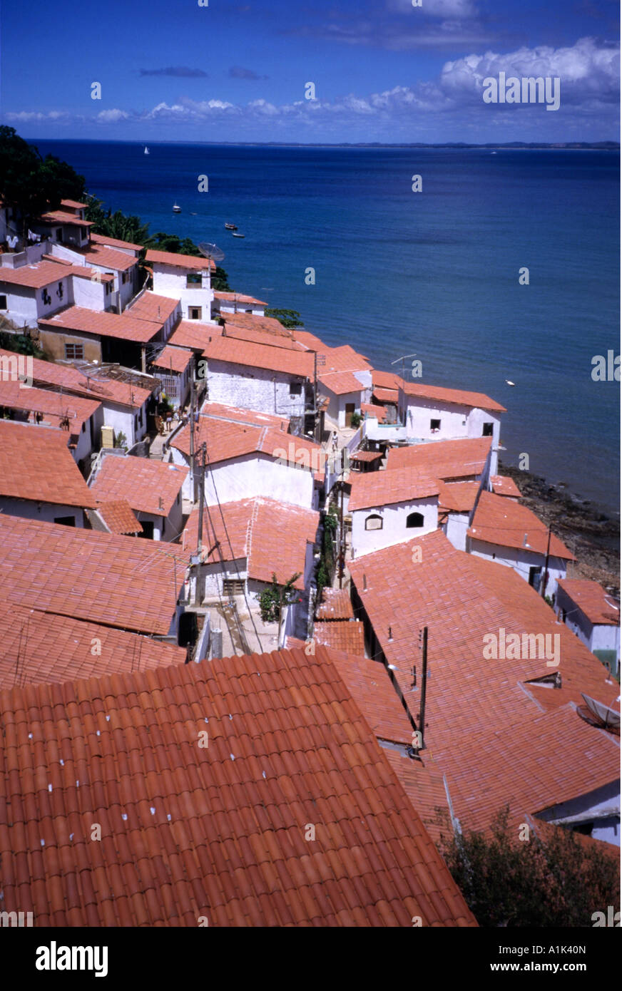 Red tile roofed homes in Salvador Bahia Brazil look out on the Bay of All Saints  ( Baia de Todos os Santos) Stock Photo