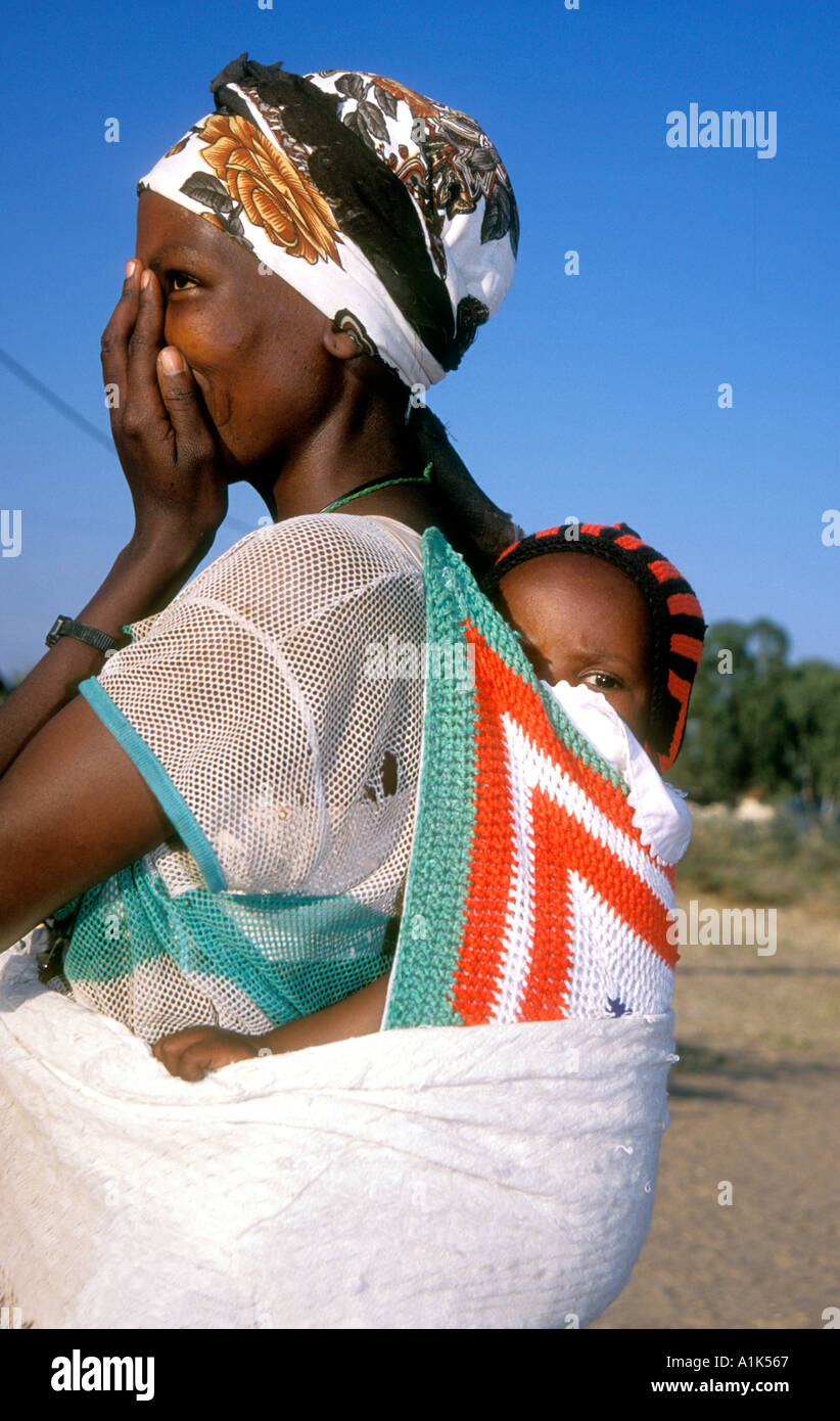 San woman small town of Drimiopsis in Central eastern Namibia San bushmen have an oriental look and heart shaped faces Namibia Stock Photo