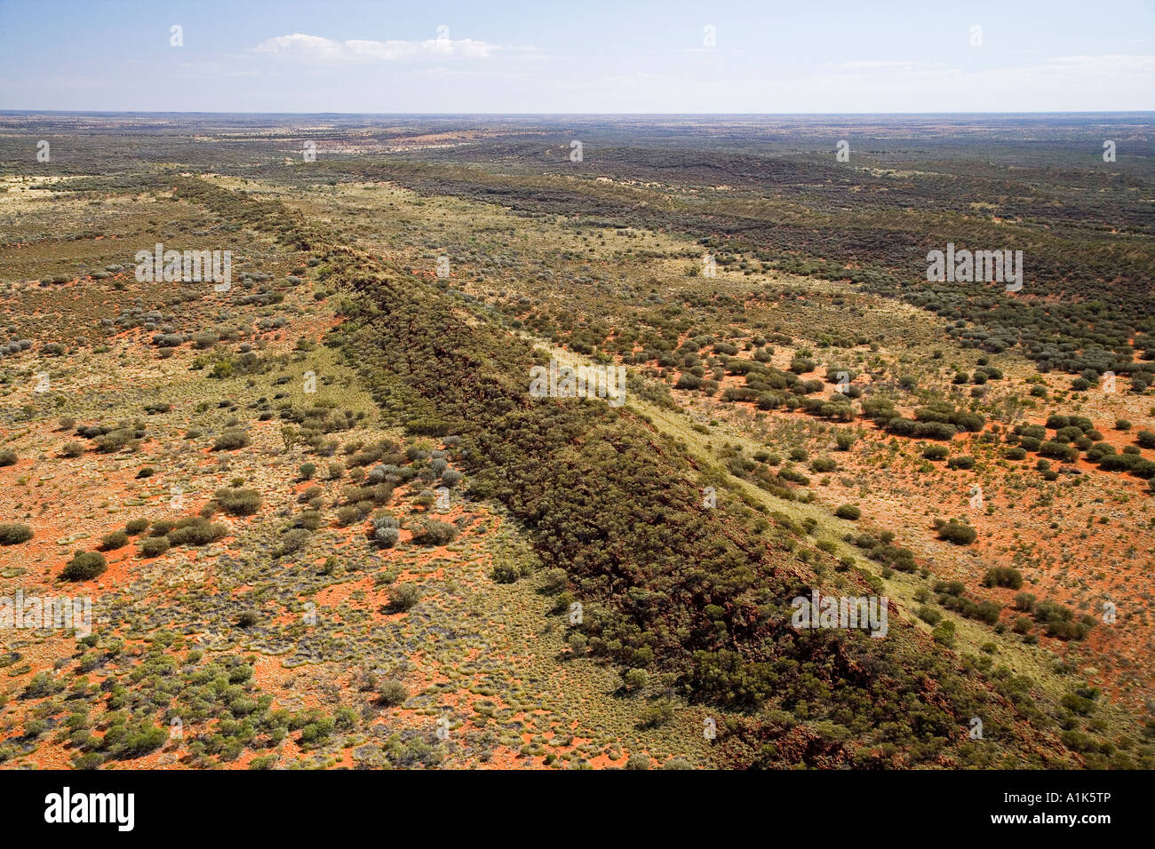 Low Rock Ridgeline in Desert near Uluru Kata Tjuta National Park Northern Territory Australia aerial Stock Photo