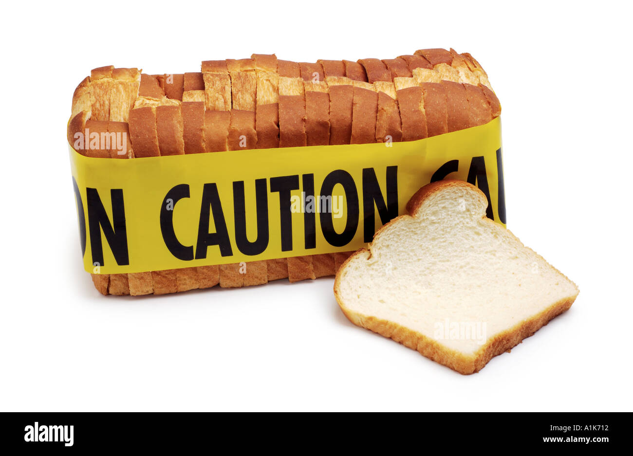 Low Carbohydrate diet Caution tape around loaf of bread Stock Photo