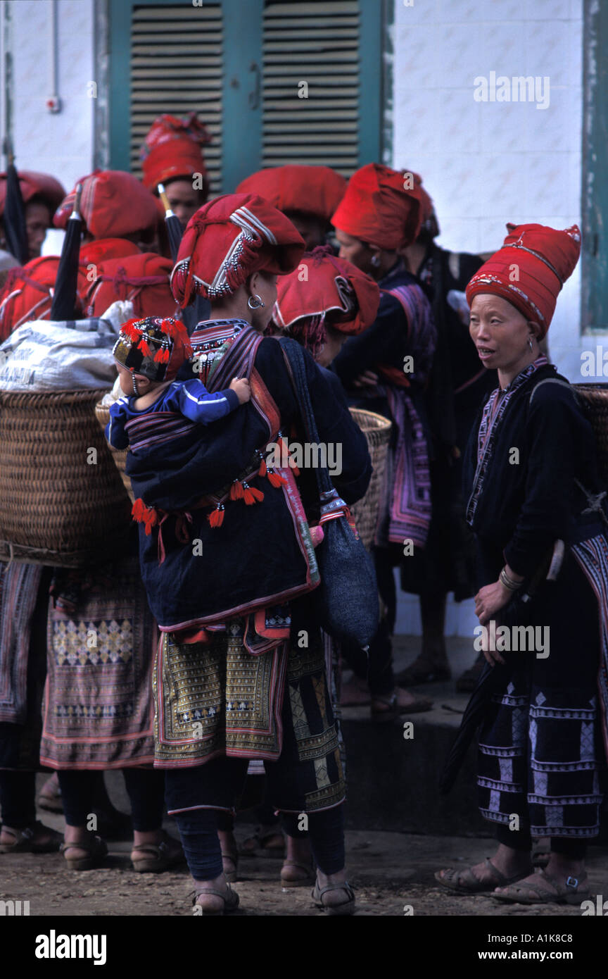 Red Dao women at Sapa market A hilltribe community in a rural setting Northern Vietnam Stock Photo