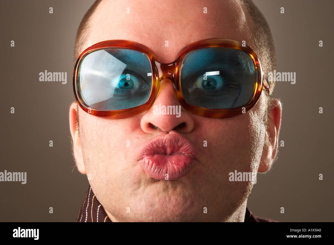 MR Cool guy looks like Elton John Stock Photo