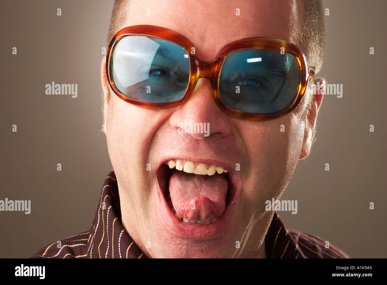 MR Cool guy looks like Elton John Stock Photo