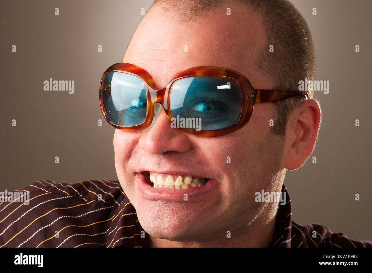 MR Cool guy looks like Elton John Stock Photo