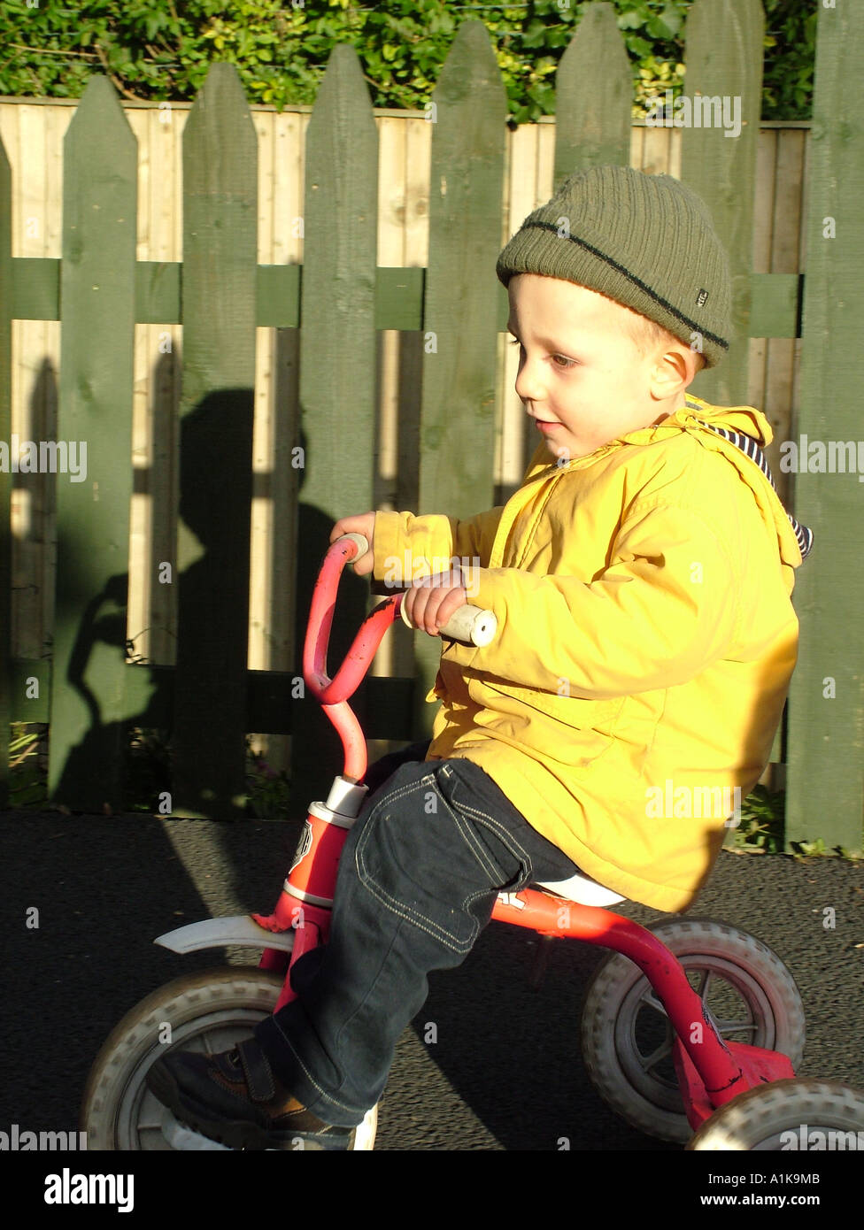Boy on tricycle Stock Photo Alamy