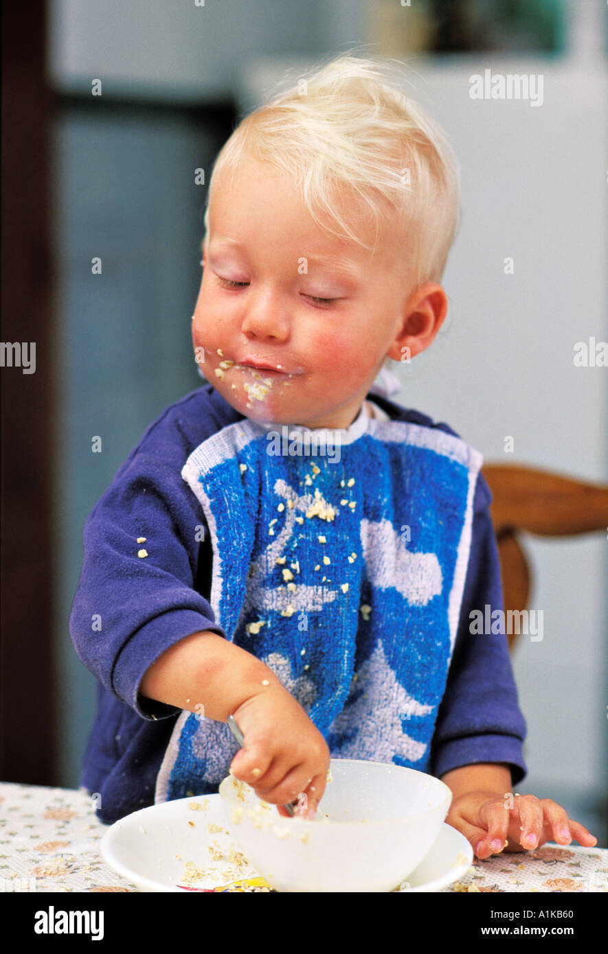 One year old eating proud his muesli MR Stock Photo Alamy