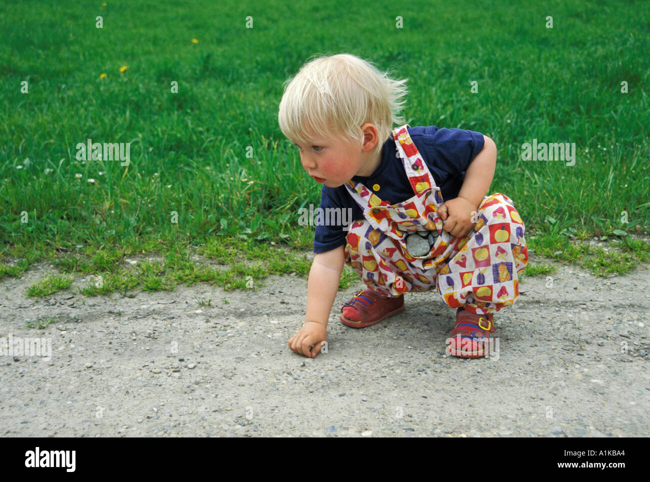 Children collecting stones hires stock photography and images Alamy