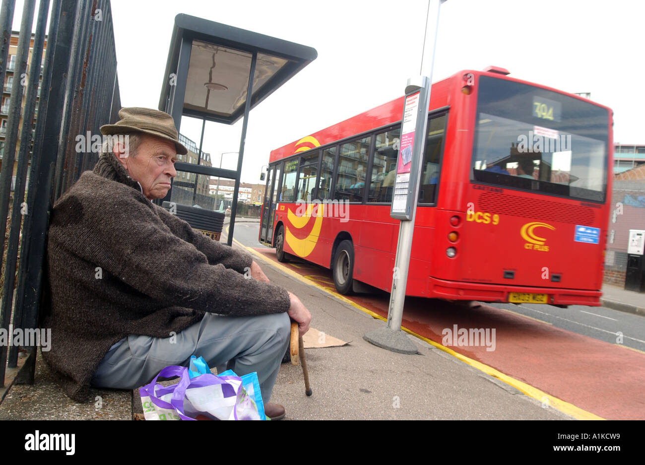 Elderly man waiting for bus in East End, London Stock Photo