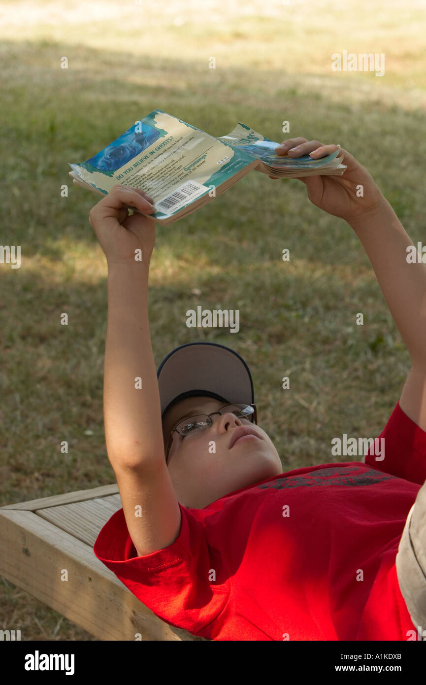 Boy lying down on bench hi-res stock photography and images - Alamy