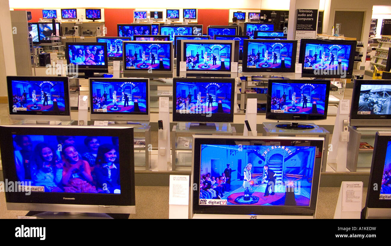 High definition digital flat screen LCD and plasma televisions of various sizes on display at a department store Stock Photo