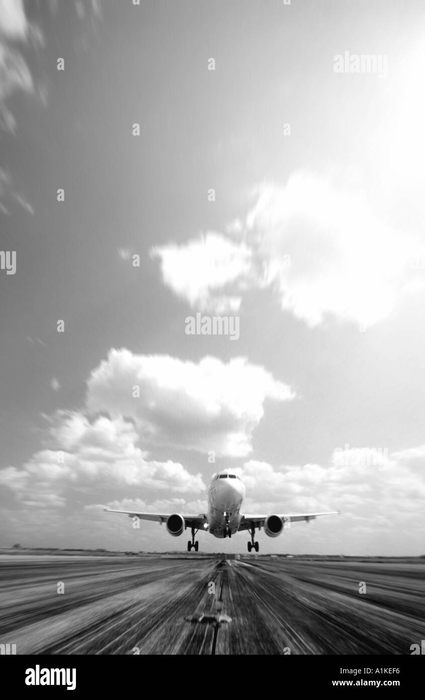 Airbus passenger aircraft landing on runway Stock Photo