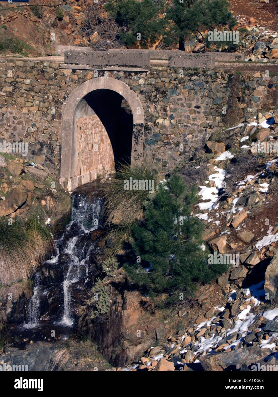 Snow in Spain mountain stream waterfall cascade water bridge culvert ...