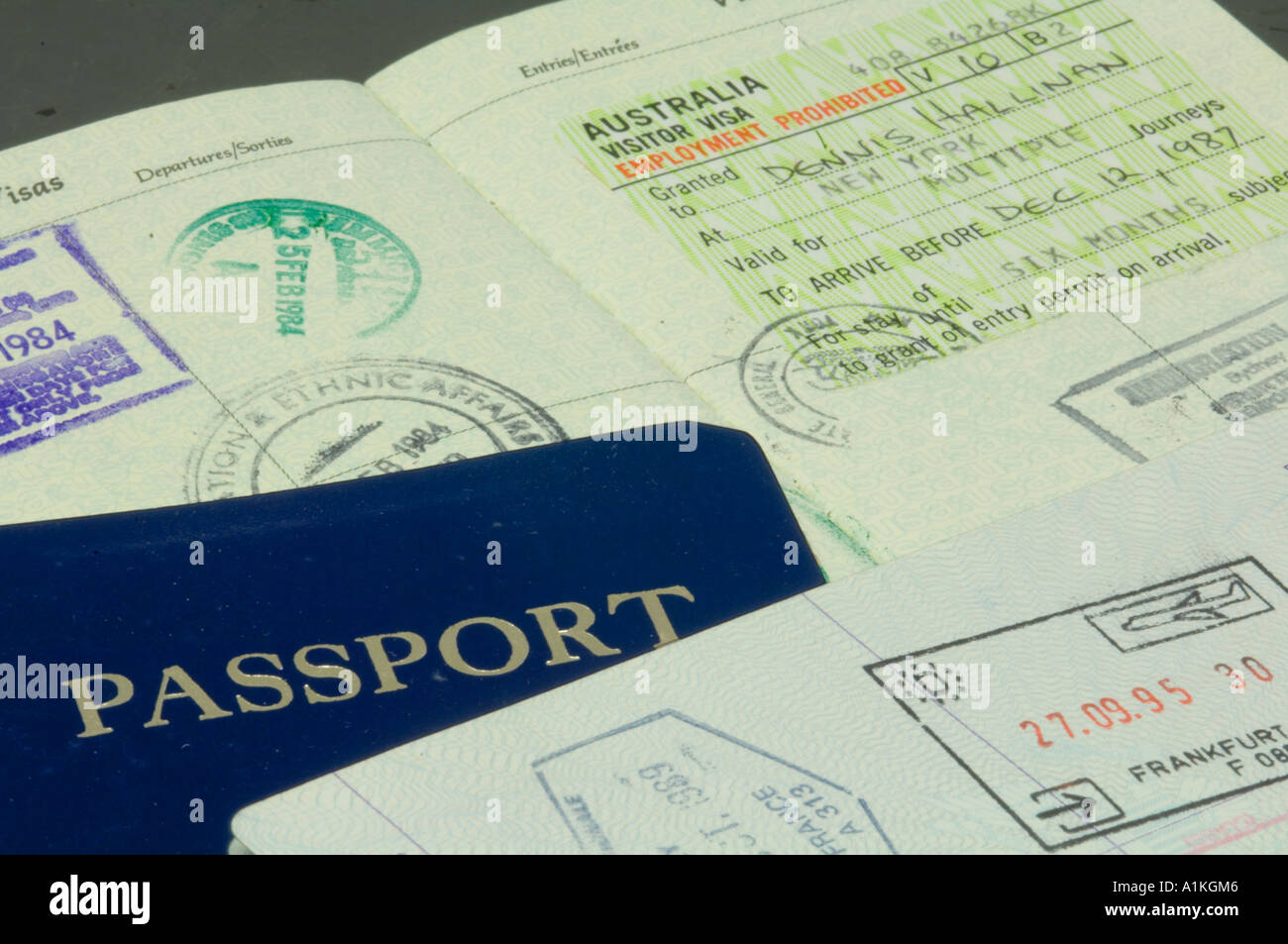 closeup of American passport showing customs stamps from Singapore and